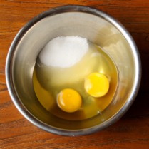 Place eggs and sugar in a bowl