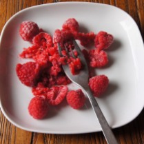 Slightly mash raspberries